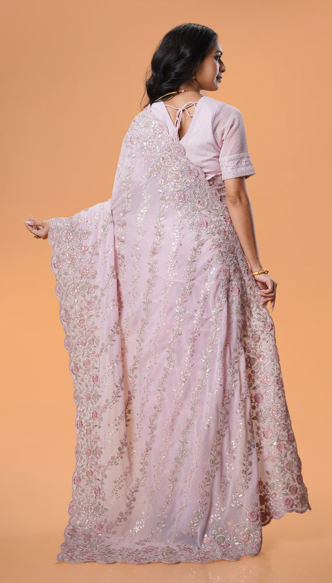 Flawless Pink Georgette Saree with Artistic Zari Embroidery