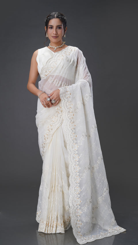 Graceful Cream Organza Saree with Stunning Stone Embellishments