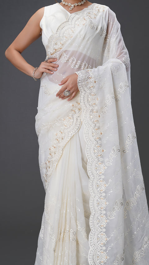 Graceful Cream Organza Saree with Stunning Stone Embellishments