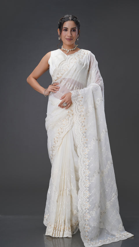 Graceful Cream Organza Saree with Stunning Stone Embellishments