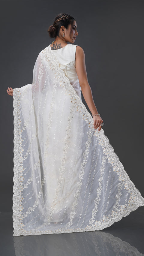 Graceful Cream Organza Saree with Stunning Stone Embellishments