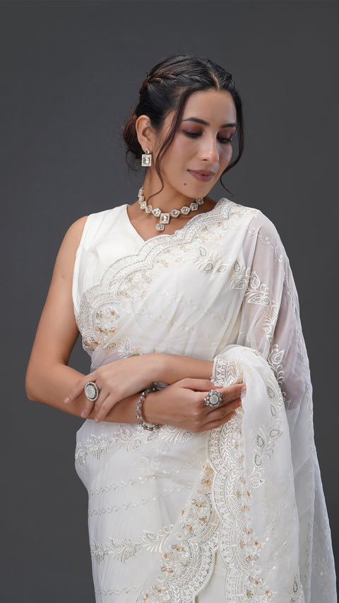 Graceful Cream Organza Saree with Stunning Stone Embellishments